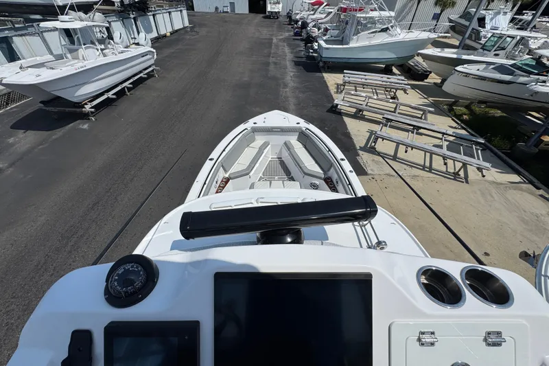Slide: The Image of 2022 Everglades 395 Center Console boat on display at a marina. - 36
