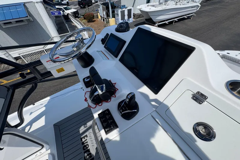 Slide: The Image of Helm of 2022 Everglades 395 Center Console with modern controls and displays. - 37