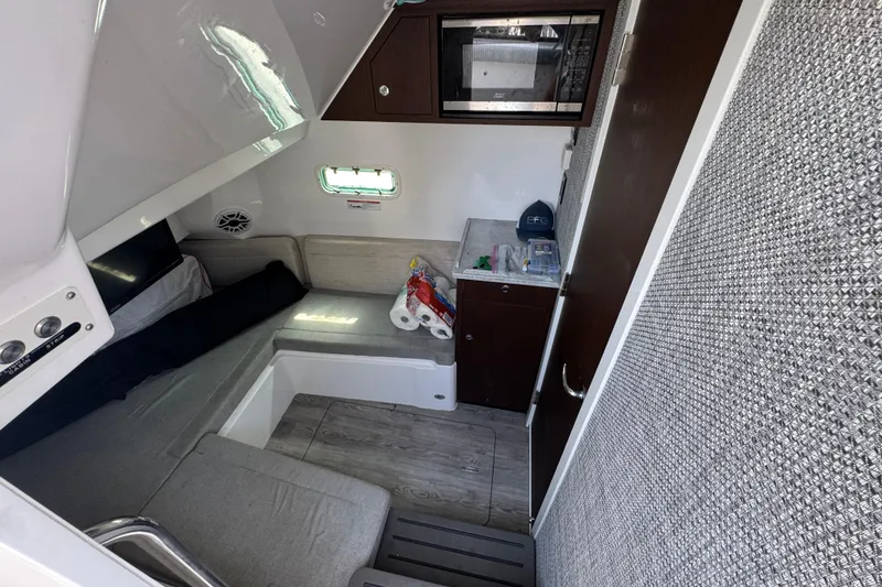 Slide: The Image of Interior cabin of 2022 Everglades 395 Center Console boat with seating and storage. - 47