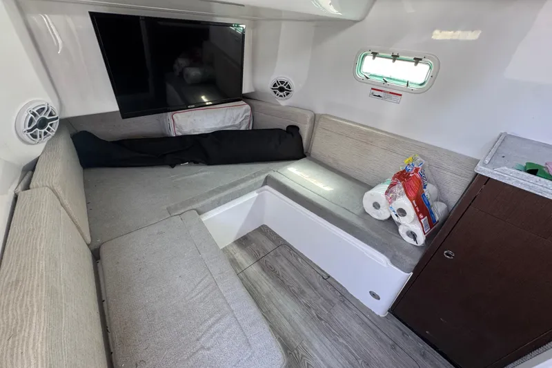 Slide: The Image of Interior cabin of 2022 Everglades 395 Center Console boat with seating and supplies. - 48