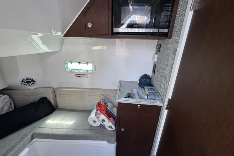 Slide: The Image of Interior cabin of 2022 Everglades 395 Center Console with seating and storage. - 49