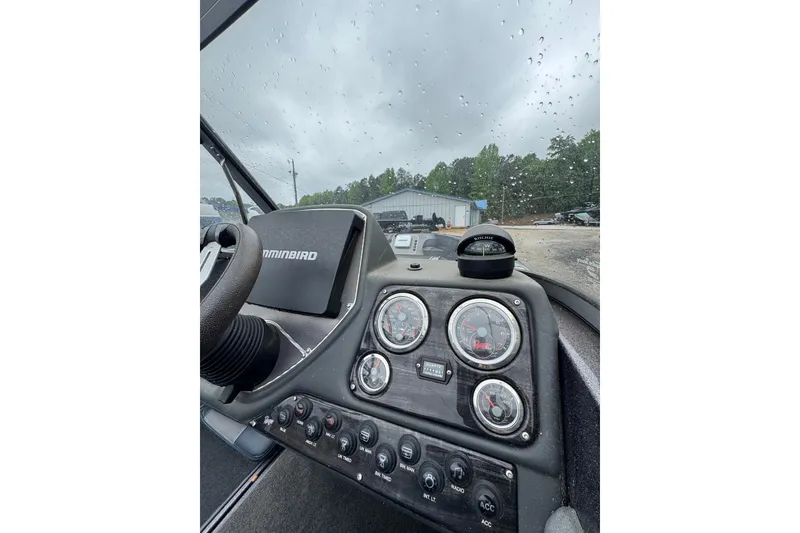 Slide: The Image of Dashboard of a 2013 Ranger 1850 LS boat with gauges and controls. - 10