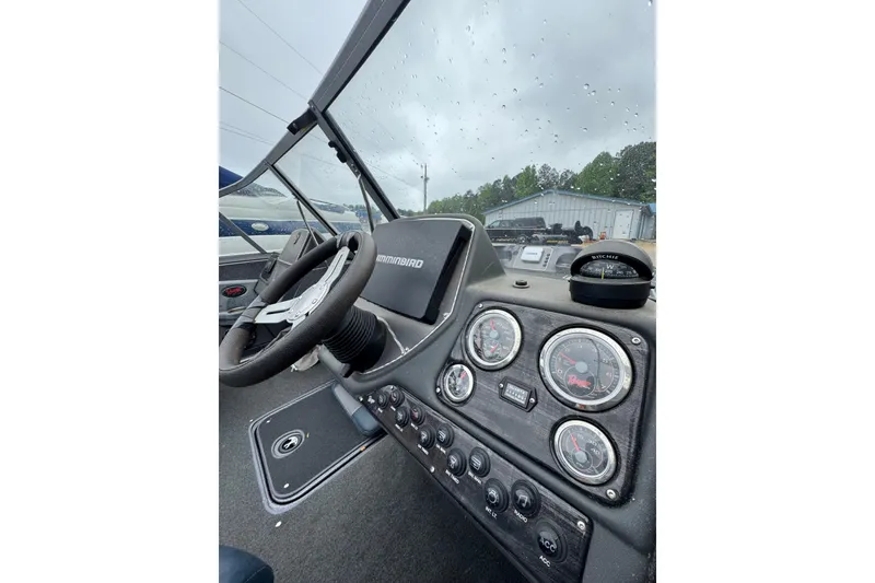 Slide: The Image of 2013 Ranger 1850 LS boat dashboard with steering wheel and gauges. - 3