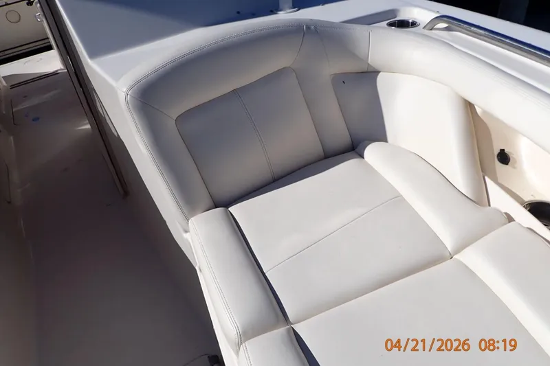 Slide: The Image of 2016 Grady-White Freedom 335 boat interior with white cushioned seating. - 13