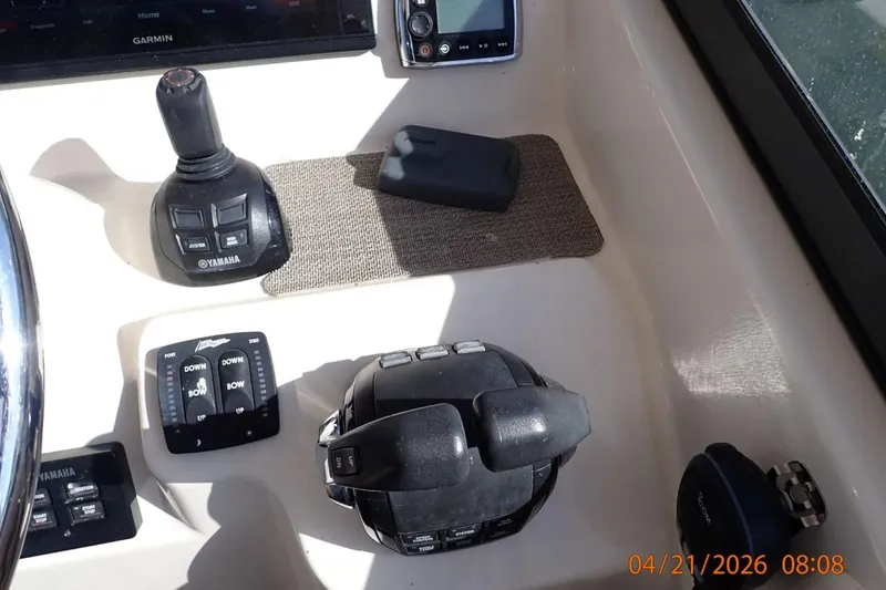 Slide: The Image of Control panel of a 2016 Grady-White Freedom 335 boat with Yamaha controls. - 18