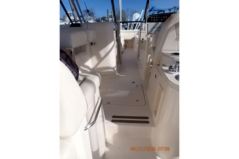 Slide: The Image of Interior view of 2016 Grady-White Freedom 335 boat, showcasing seating and helm area. - 22