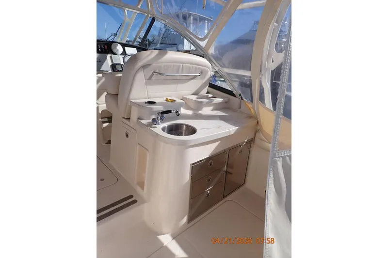 Slide: The Image of 2016 Grady-White Freedom 335 boat interior with sink and storage drawers. - 23