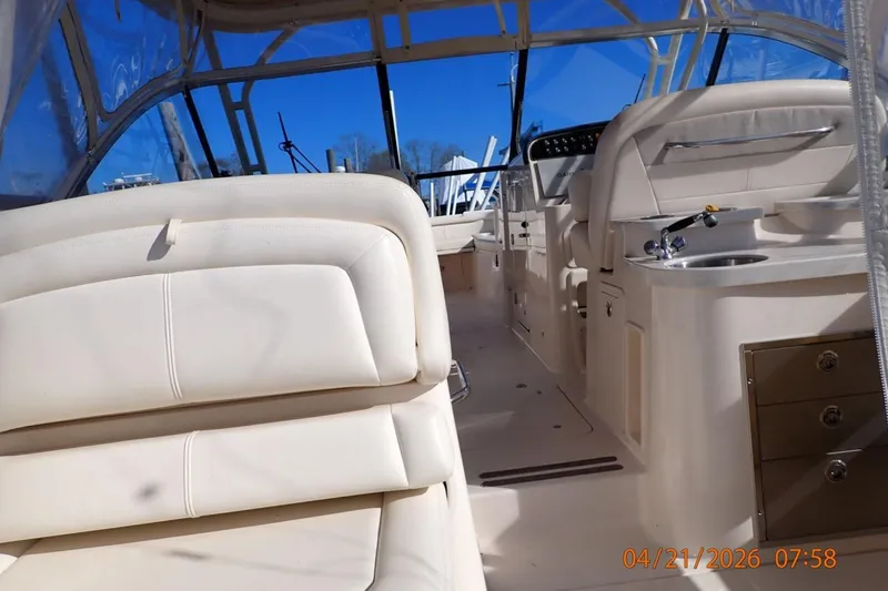 Slide: The Image of Interior of 2016 Grady-White Freedom 335 boat with seating and helm. - 24