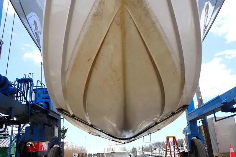 Slide: The Image of 2016 Grady-White Freedom 335 boat hull in dry dock, viewed from below. - 33
