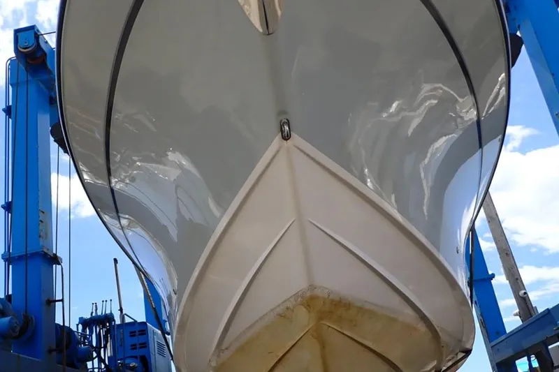 Slide: The Image of 2016 Grady-White Freedom 335 boat hull in dry dock, viewed from below. - 34