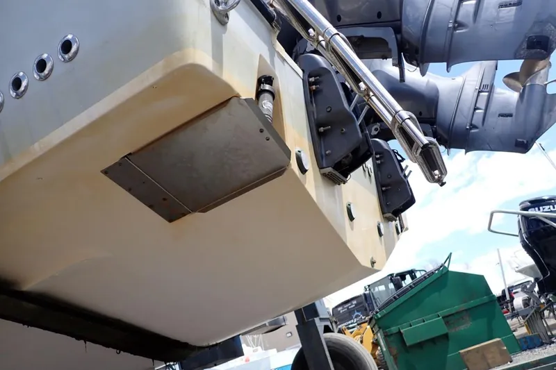 Slide: The Image of 2016 Grady-White Freedom 335 boat underside with dual outboard motors. - 36