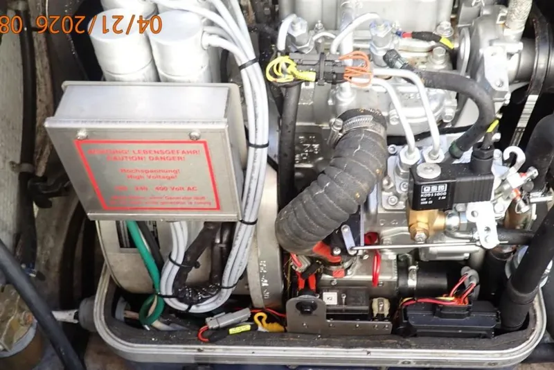 Slide: The Image of Engine compartment of a 2016 Grady-White Freedom 335 boat, showing wiring and components. - 40