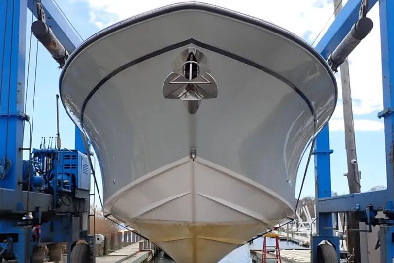 Slide: The Image of 2016 Grady-White Freedom 335 boat in dry dock, front view. - 6