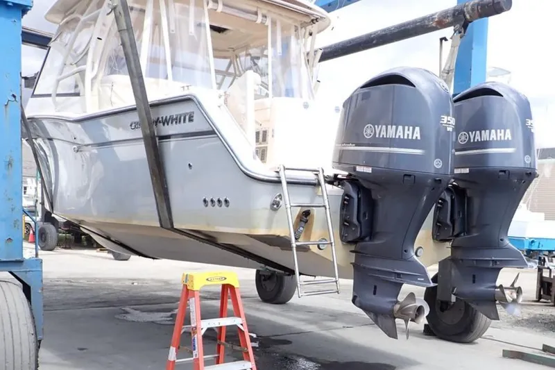 Slide: The Image of 2016 Grady-White Freedom 335 boat with dual Yamaha 350 engines in a boatyard. - 9