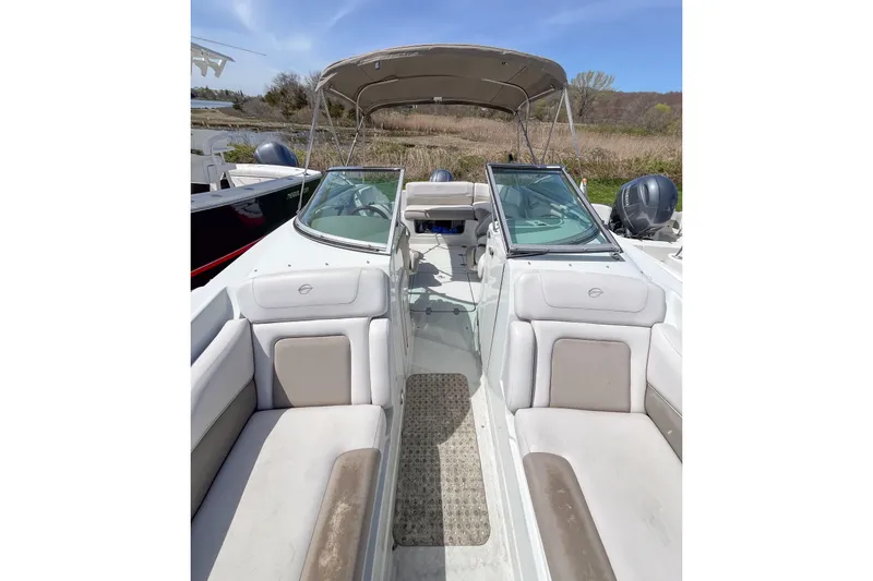 Slide: The Image of 2015 Crownline Eclipse E2 XS boat interior with seating and canopy. - 5