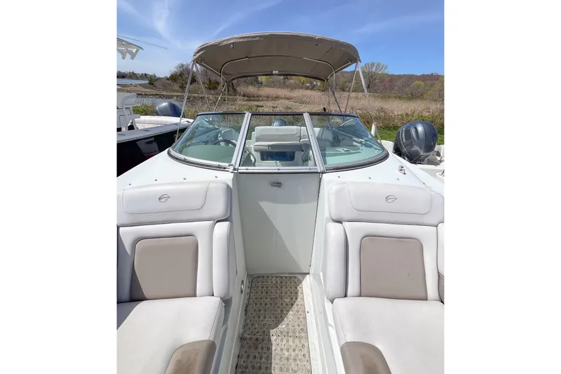 Slide: The Image of 2015 Crownline Eclipse E2 XS boat interior with seating and canopy. - 6