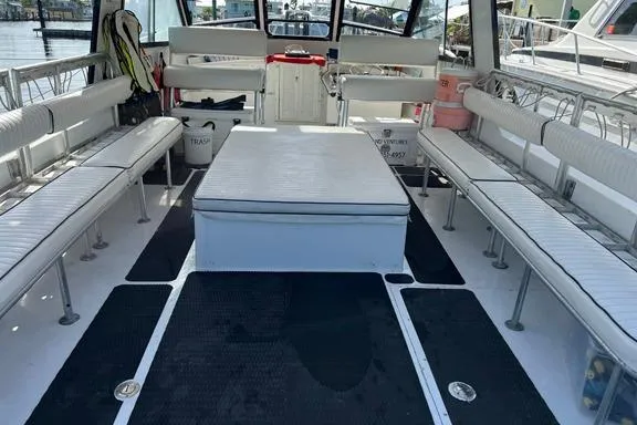 Slide: The Image of Interior of a 1996 Island Hopper Forward Cabin Dive Boat with seating and equipment. - 5
