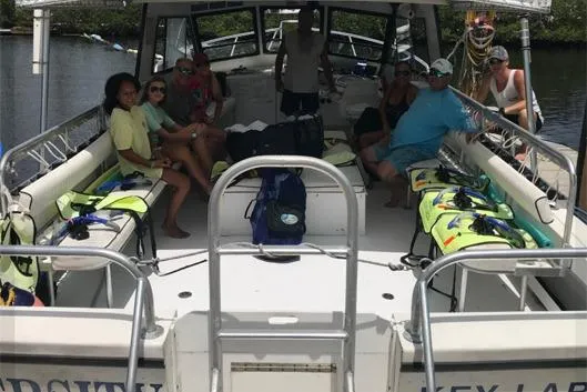 Slide: The Image of Group relaxing on a 1996 Island Hopper Forward Cabin Dive Boat. - 6