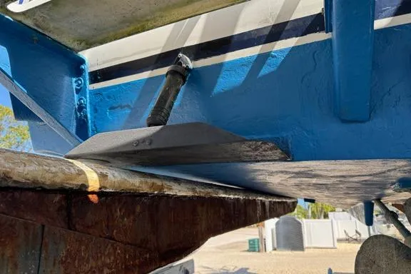 Slide: The Image of 1996 Island Hopper Forward Cabin Dive Boat underside, showcasing hull and rudder details. - 9