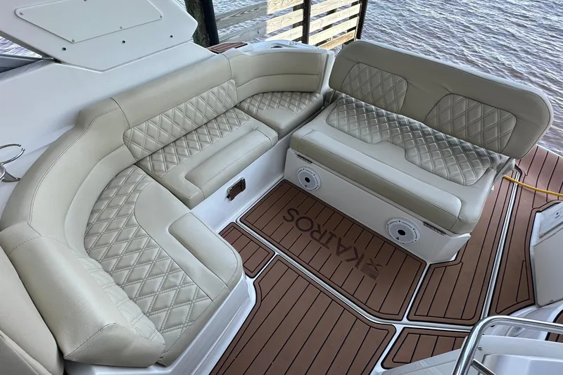 Slide: The Image of Luxurious seating on a 2014 Monterey 260 Sport Yacht with diamond-stitched upholstery. - 21