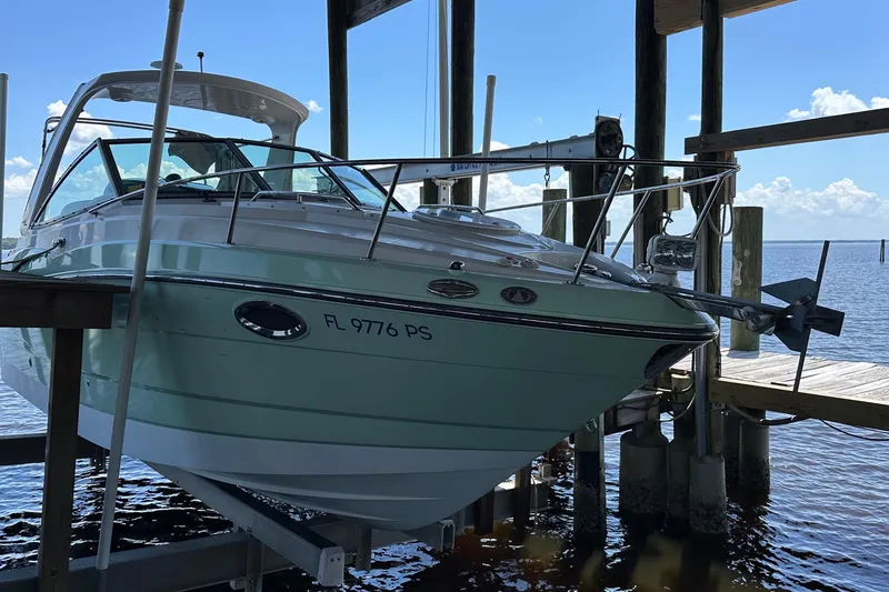 Slide: The Image of 2014 Monterey 260 Sport Yacht docked, showcasing sleek design and modern features. - 8