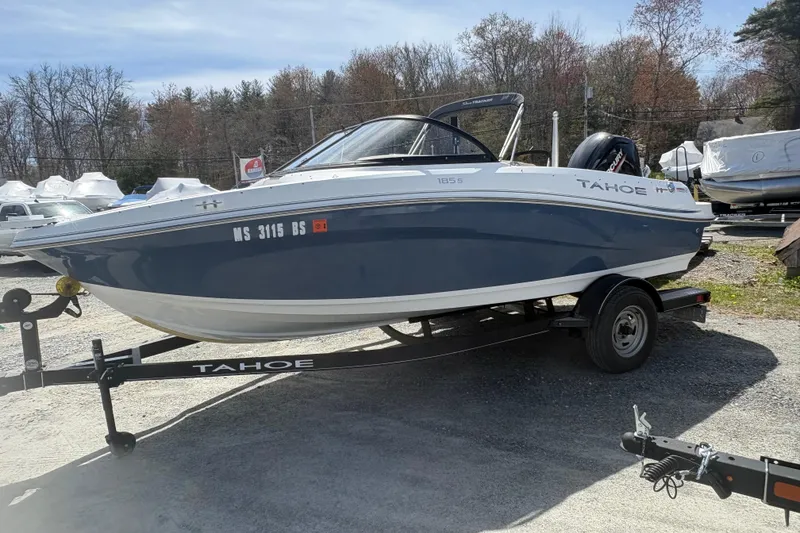 The Image of 2022 Tahoe 185 S boat on trailer, parked outdoors, showcasing sleek design and modern features. - 0