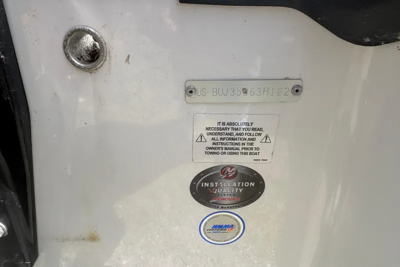 Slide: The Image of 2022 Tahoe 185 S boat identification plate with safety and quality labels. - 10
