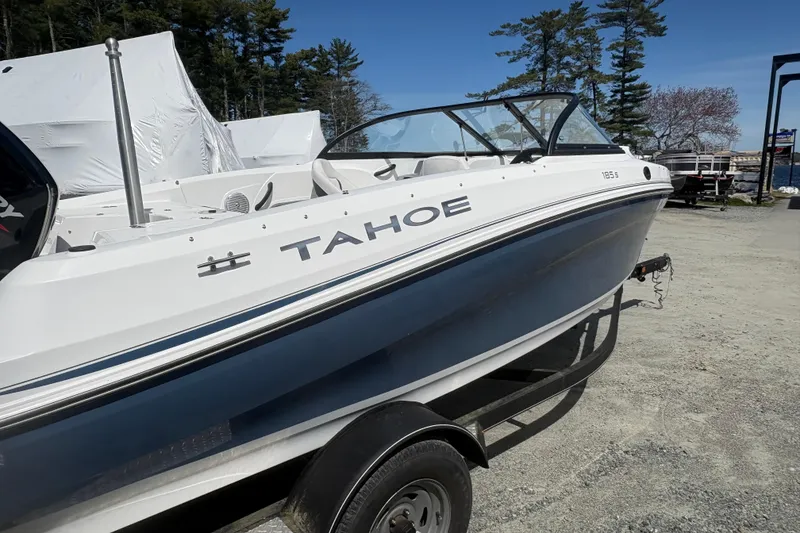 Slide: The Image of 2022 Tahoe 185 S boat on trailer, parked outdoors, ready for adventure. - 2