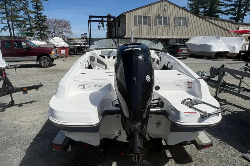 Slide: The Image of 2022 Tahoe 185 S boat with outboard motor in a marina setting. - 3