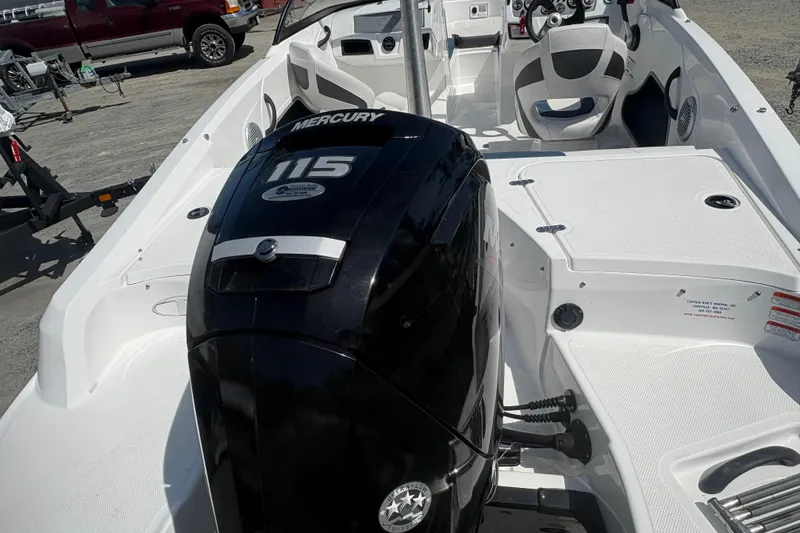 Slide: The Image of 2022 Tahoe 185 S boat interior with Mercury 115 engine, featuring seating and controls. - 4