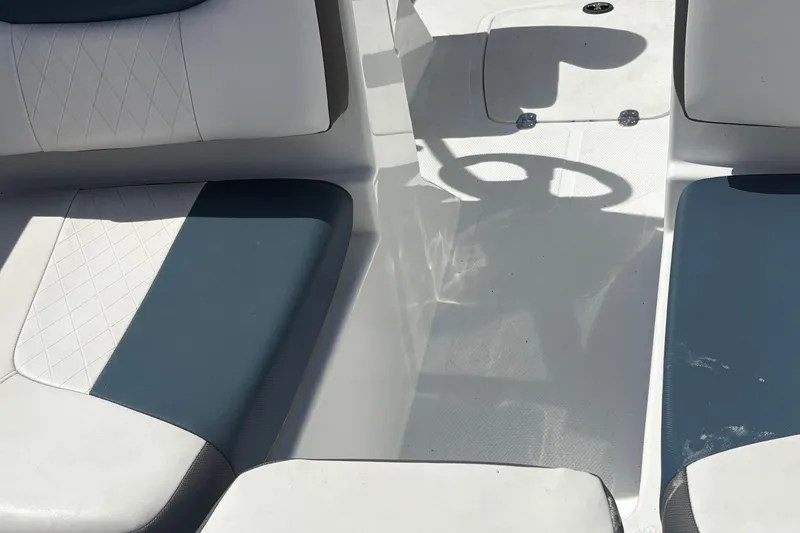 Slide: The Image of Interior seating of 2022 Tahoe 185 S boat with white and blue upholstery. - 9