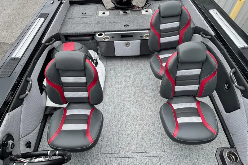 Slide: The Image of 2023 Ranger VX1888 WT boat interior with four gray and red seats. - 12