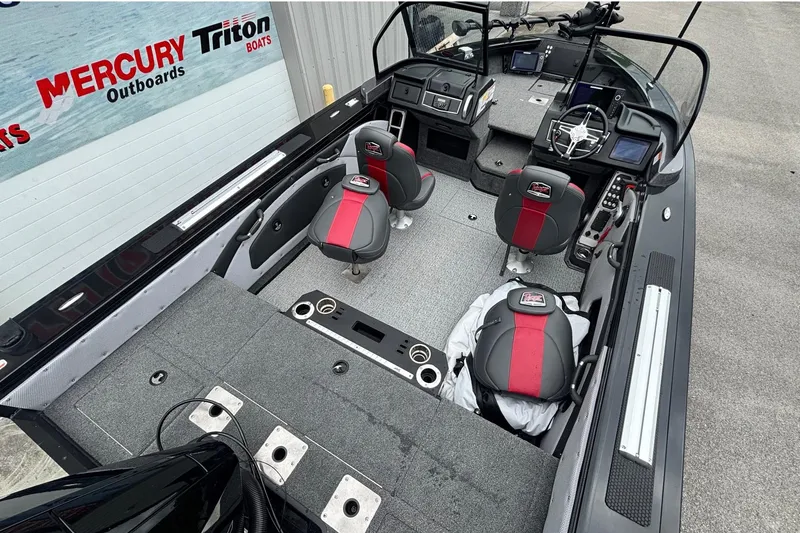 Slide: The Image of 2023 Ranger VX1888 WT boat interior with red and black seating, advanced controls, and spacious layout. - 14
