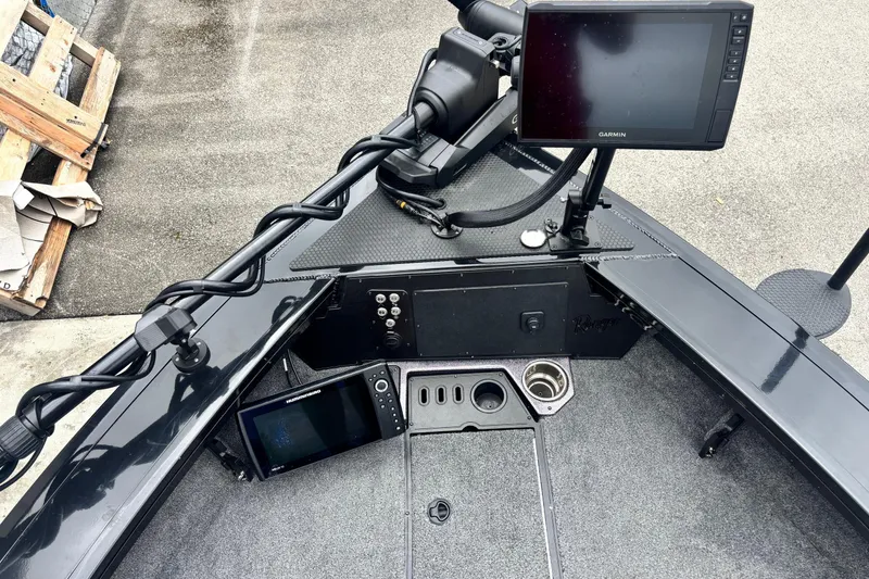 Slide: The Image of 2023 Ranger VX1888 WT boat dashboard with Garmin and Humminbird displays. - 4