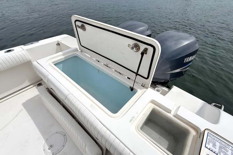 Slide: The Image of Open storage compartment on 2007 Sea Hunt Gamefish 29 boat with Yamaha engines. - 10