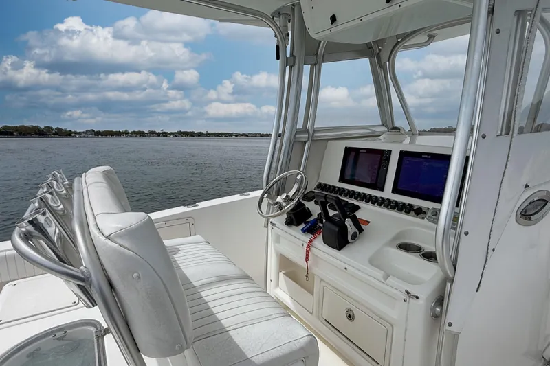Slide: The Image of 2007 Sea Hunt Gamefish 29 boat interior with dual screens and steering wheel. - 14
