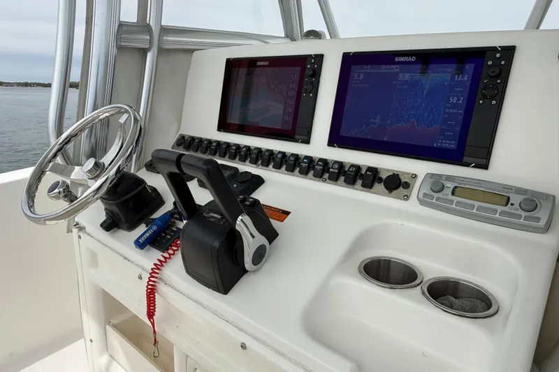Slide: The Image of Control panel of a 2007 Sea Hunt Gamefish 29 with dual Simrad displays. - 15