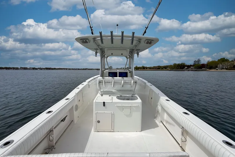 Slide: The Image of 2007 Sea Hunt Gamefish 29 boat on calm water under a partly cloudy sky. - 4
