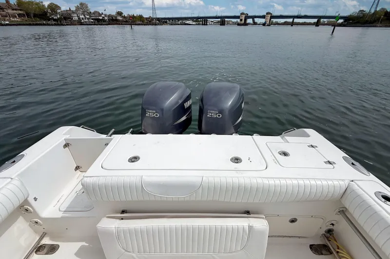 Slide: The Image of 2007 Sea Hunt Gamefish 29 boat with twin Yamaha 250 engines on calm water. - 9