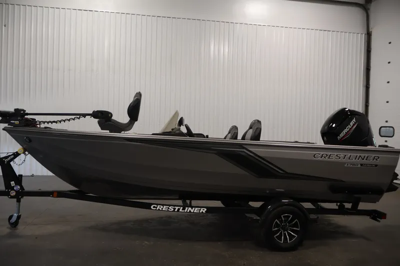 Slide: The Image of 2026 Crestliner 1750 Fish Hawk SC boat in showroom, side view. - 14
