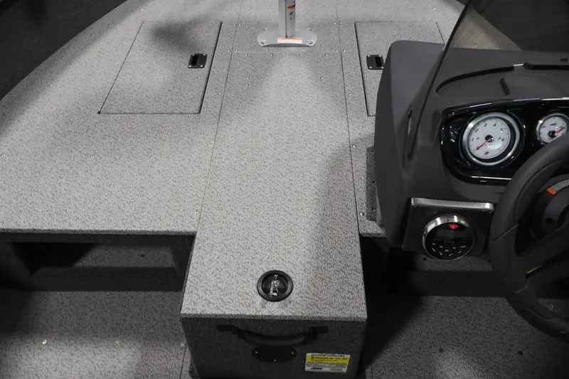 Slide: The Image of 2026 Crestliner 1750 Fish Hawk SC interior with dashboard and storage compartments. - 22