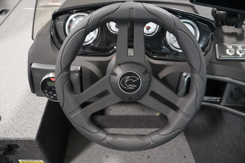 Slide: The Image of Steering wheel of 2026 Crestliner 1750 Fish Hawk SC boat with dashboard gauges. - 27