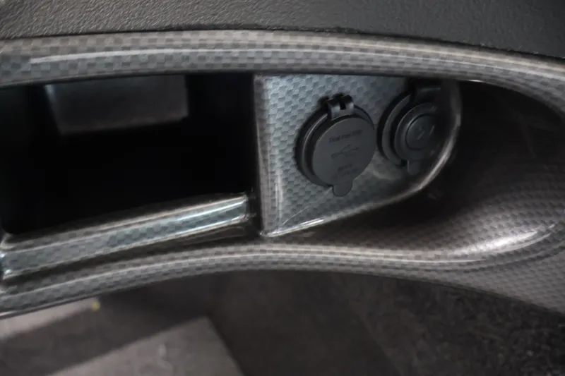Slide: The Image of Dashboard detail of 2026 Crestliner 1750 Fish Hawk SC with power outlets. - 31