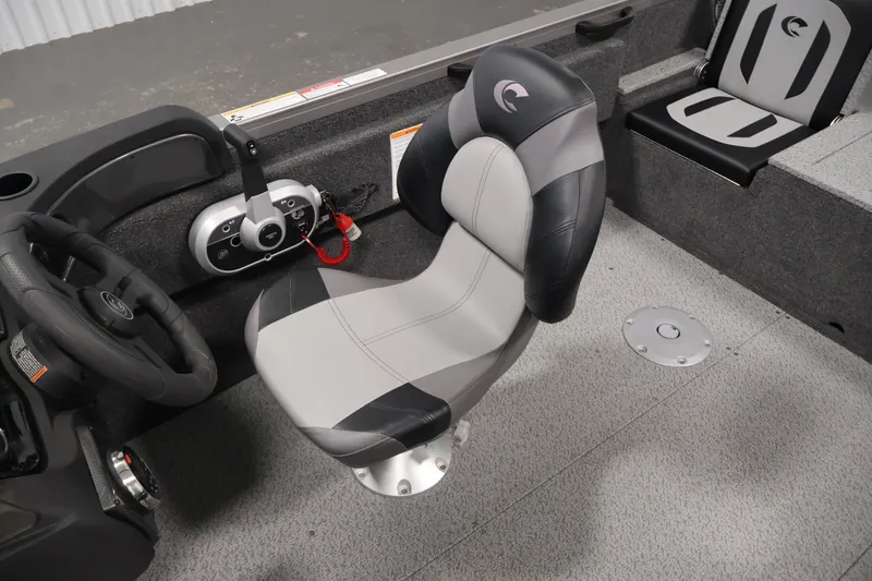 Slide: The Image of Interior of 2026 Crestliner 1750 Fish Hawk SC boat with steering wheel and seating. - 33