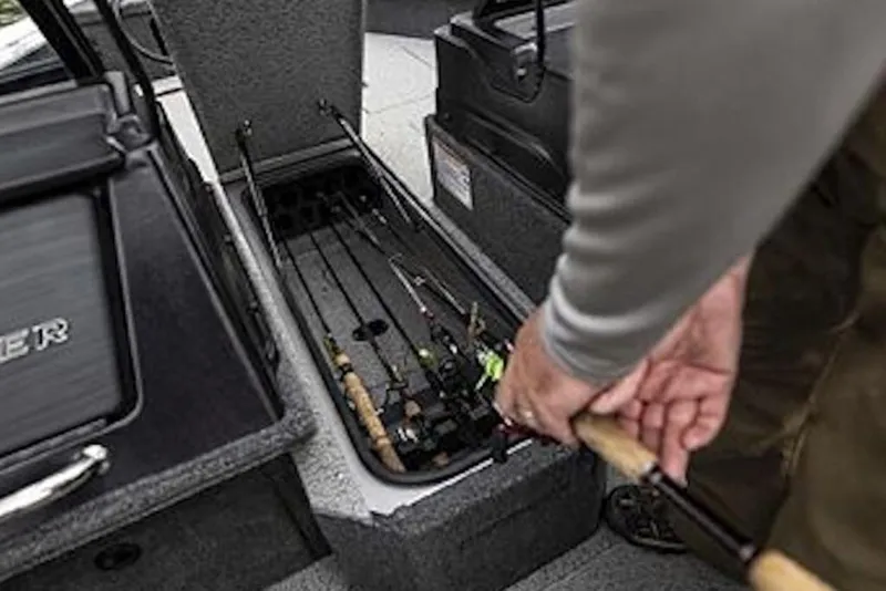 Slide: The Image of 2026 Crestliner 1750 Fish Hawk Side Console fishing rod storage compartment. - 4