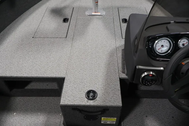 Slide: The Image of 2026 Crestliner 1750 Fish Hawk SC boat interior with dashboard and storage compartments. - 38