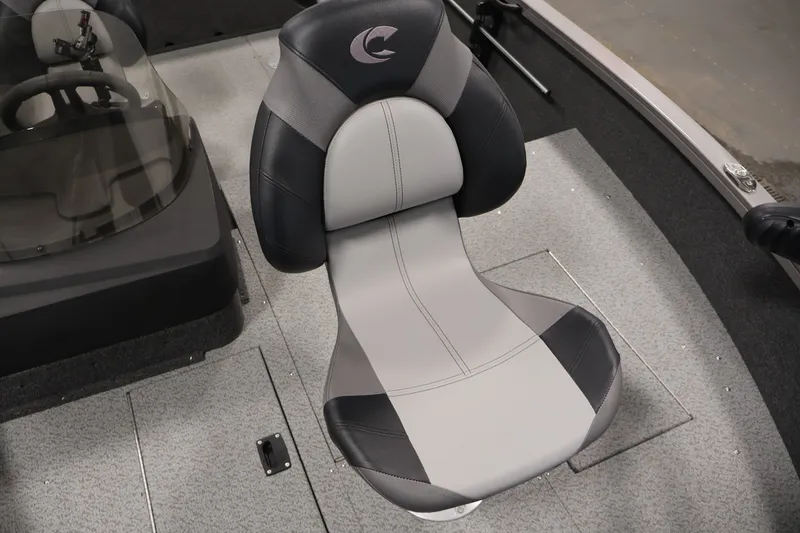 Slide: The Image of 2026 Crestliner 1750 Fish Hawk SC boat seat, gray and black design, cockpit view. - 19