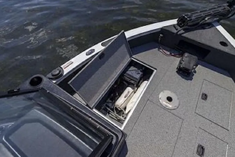 Slide: The Image of 2026 Crestliner 1750 Fish Hawk Side Console boat with open storage compartments on deck. - 5