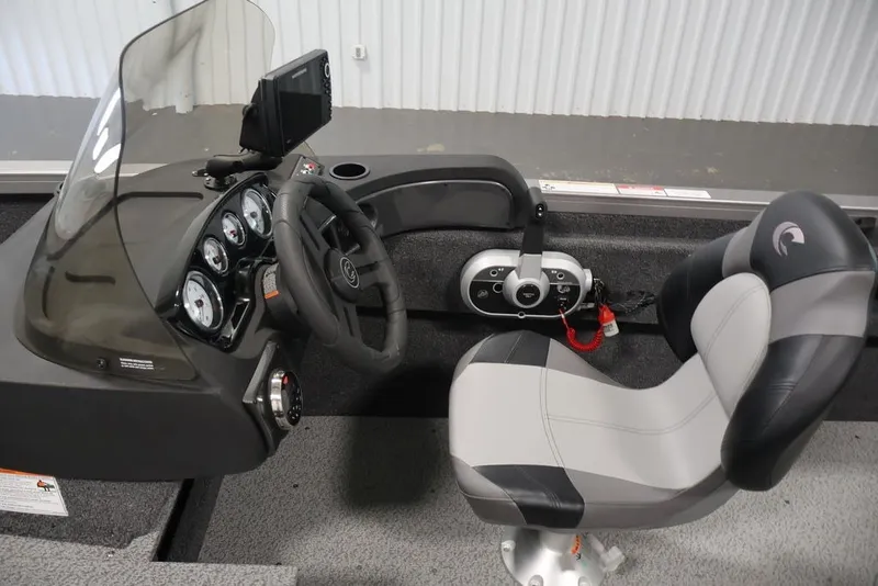 Slide: The Image of 2026 Crestliner 1750 Fish Hawk SC boat cockpit with steering wheel and control panel. - 40