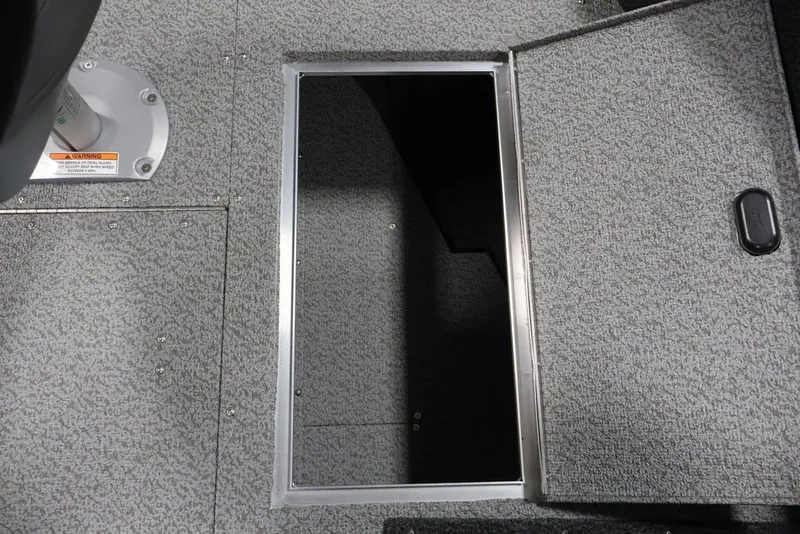 Slide: The Image of 2026 Crestliner 1750 Fish Hawk SC boat storage compartment with open hatch. - 42